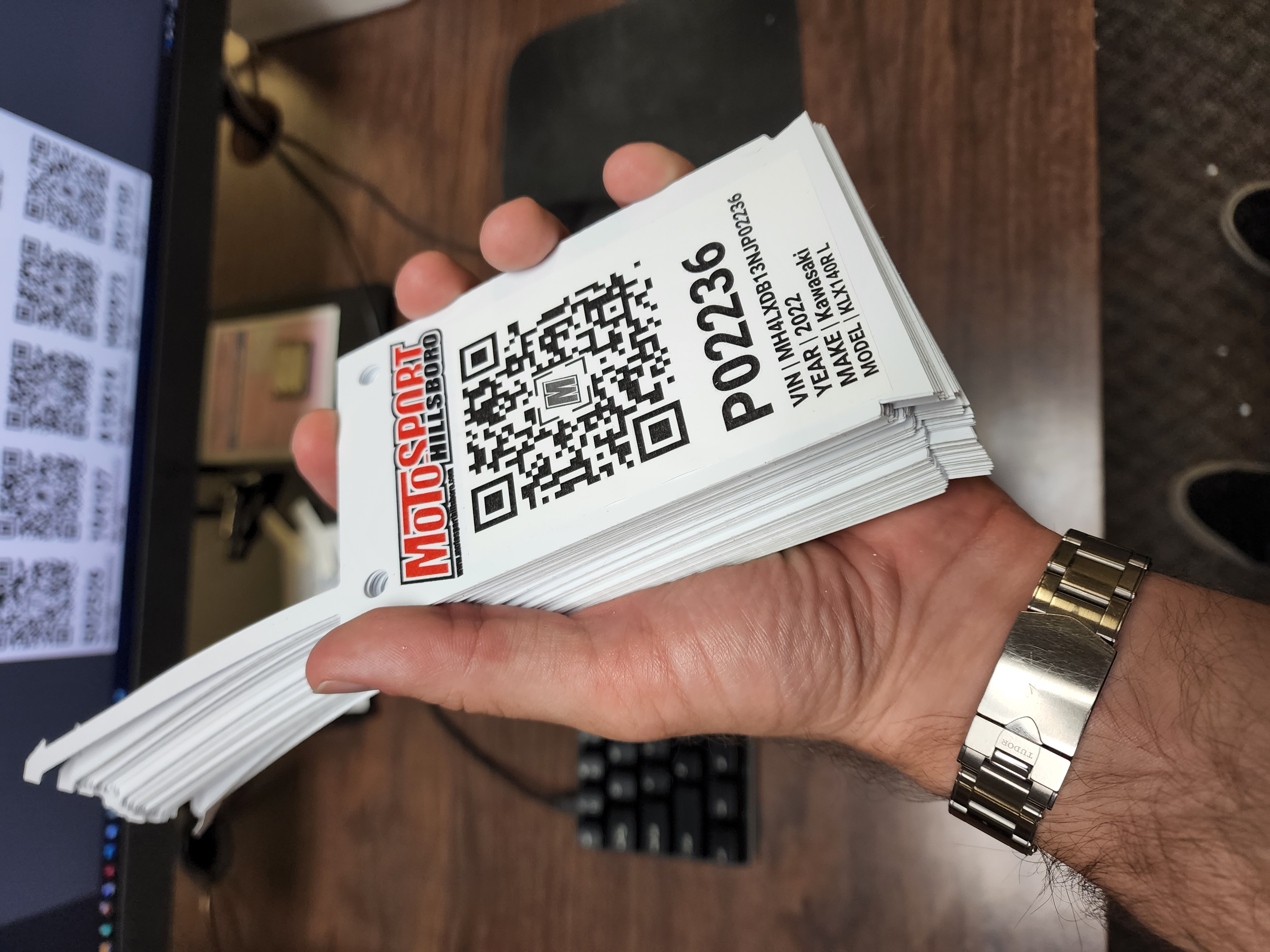 A large stack of qr codes that will be attached to various vehicles